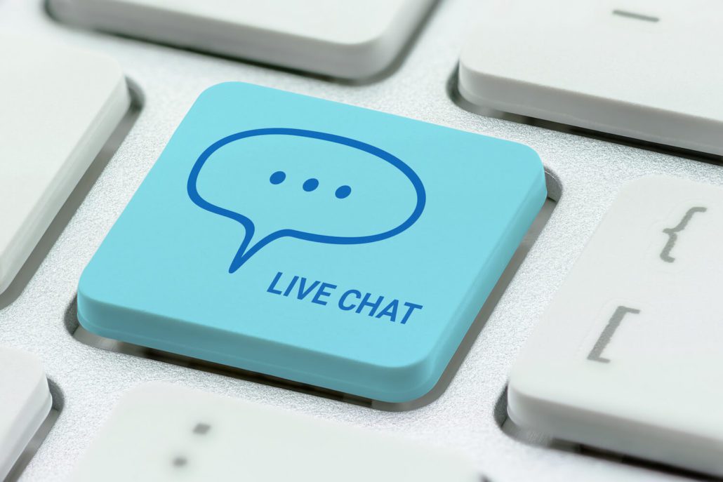 Tastaturknapp med live chat som illustrerer marketing automation